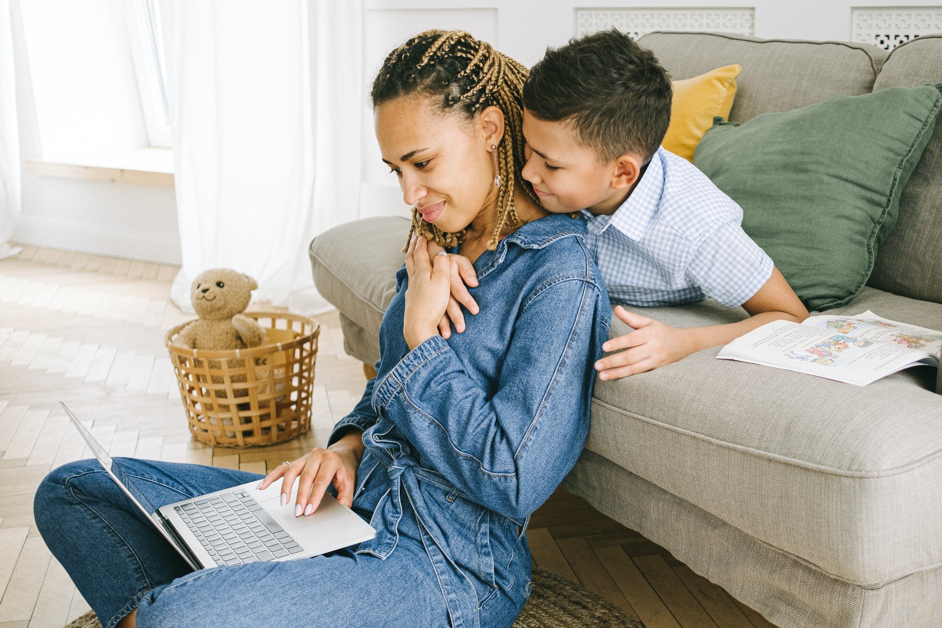 Mother remote working with son embracing  Photo by Ivan Samkov on Pexels.com